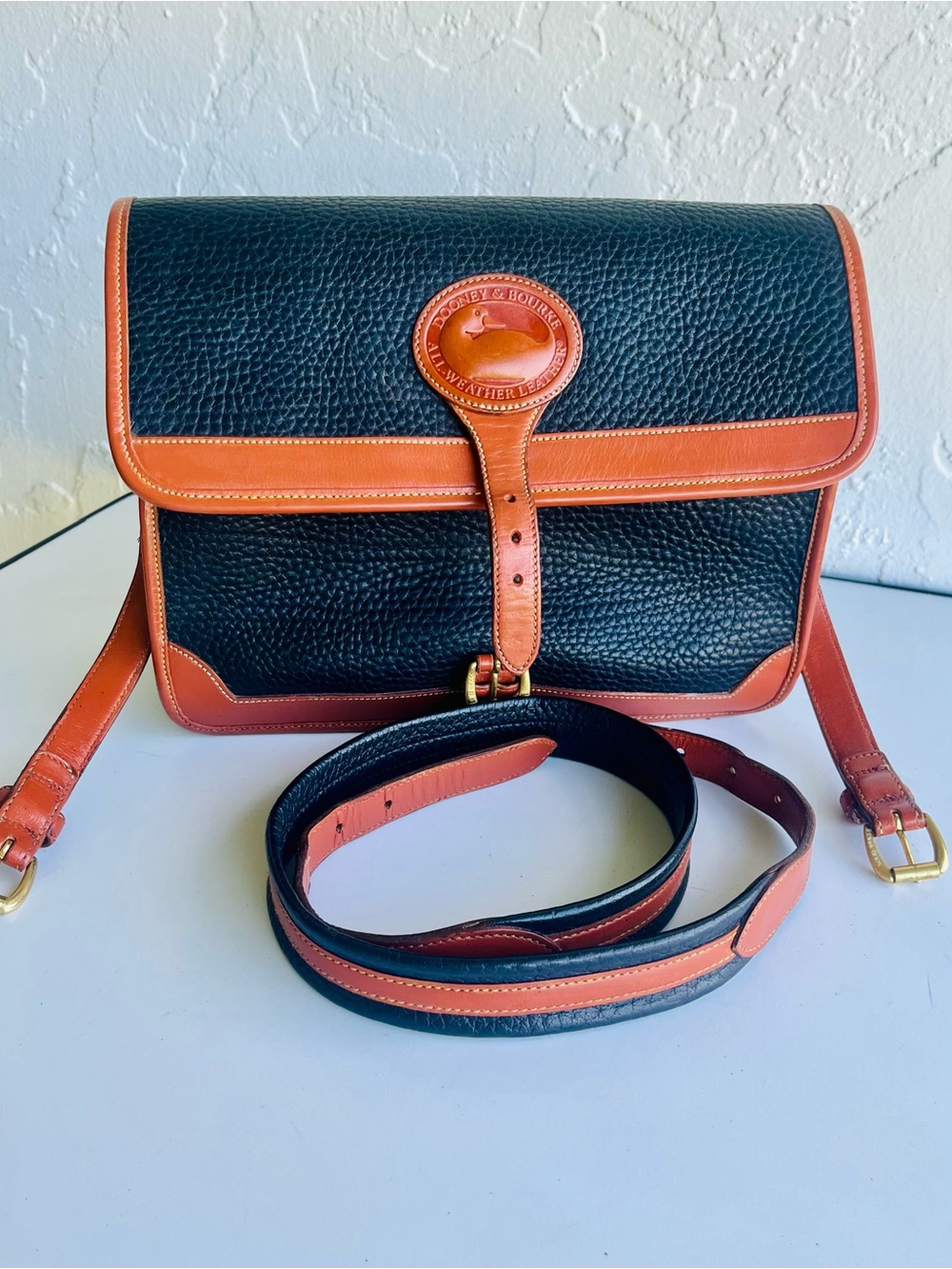 Dooney & Bourke Black with Tan Trim Pebbled Leather Crossbody